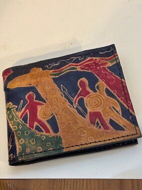 This is a leather embossed painted giraffe wallet coin pouch.